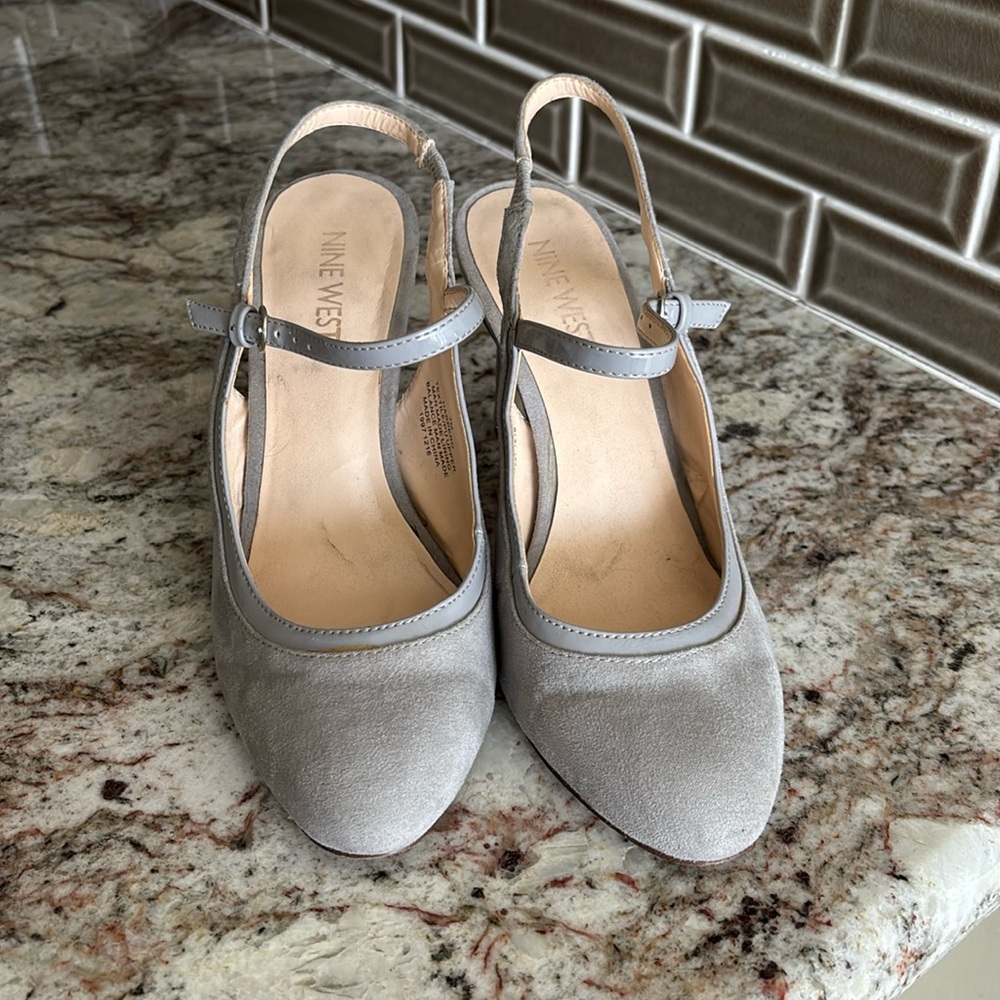 Size 7. Suede heels. Good condition. Platinum grey color